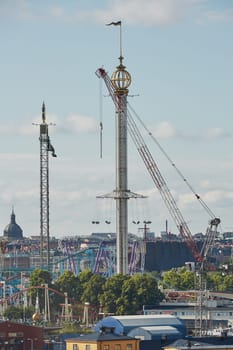 STOCKHOLM, SWEDEN - JULY 11, 2017: City landscape and Tivoli Grona Lund - Gronan - amusement park on the Djurgarden Island in Stockholm in Sweden