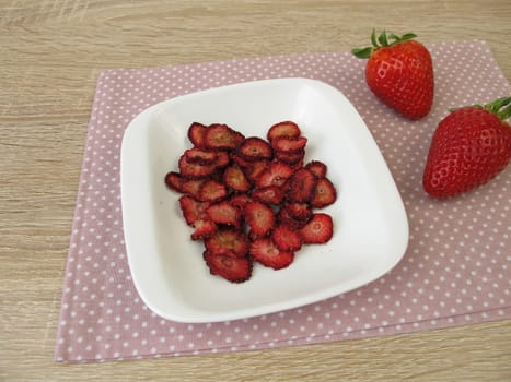 Fresh and self-dried strawberries
