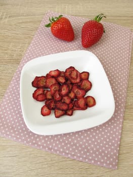 Fresh and self-dried strawberries