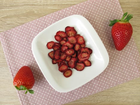 Fresh and self-dried strawberries