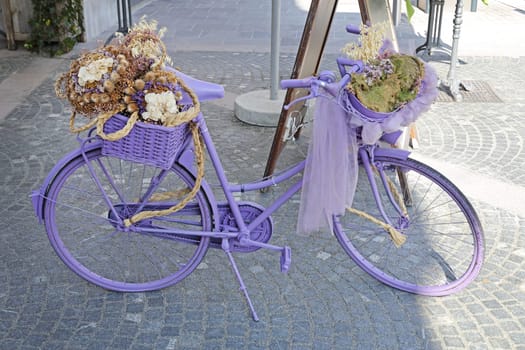 Purple Bicycle With Flowers in Basket Decoration