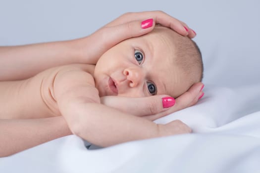 Newborn baby hand holding mother