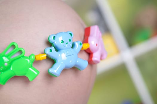 Pregnant woman with a toy