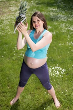 Beautiful pregnant woman at fitness gym relaxed