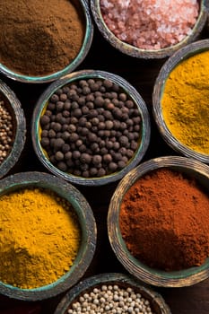 Wooden table of colorful spices