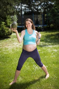Beautiful pregnant woman at fitness gym relaxed