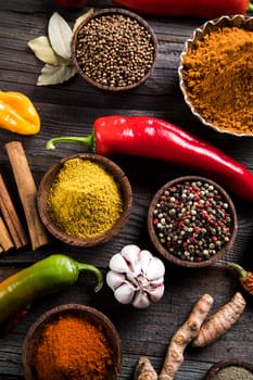 Spices over wooden background