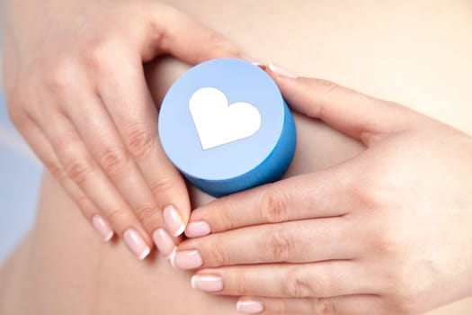 Pregnant woman holding a heart