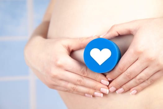 Pregnant woman holding a heart