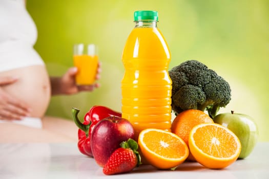 Pregnant woman with fruit and vegetables