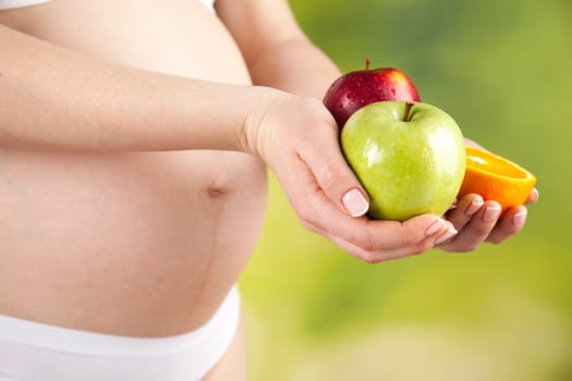 Pregnancy, healthy food and people concept