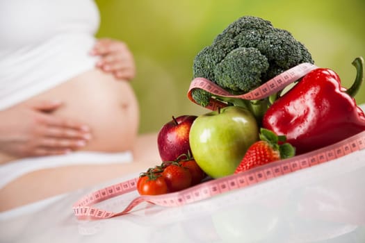 Pregnancy, healthy food and people concept