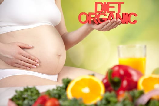 Pregnant woman with fruit and vegetables