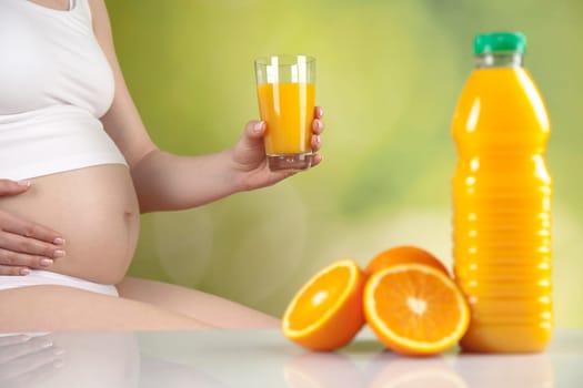 Pregnant woman with fruit and vegetables