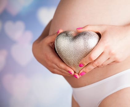 Pregnant woman loving her baby