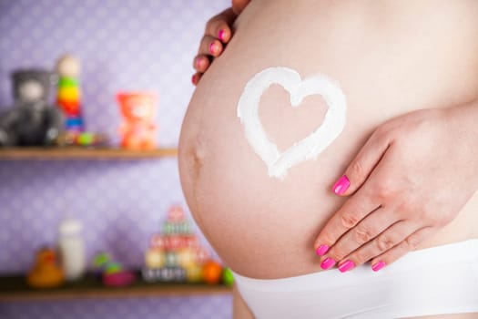 Pregnant woman loving her baby