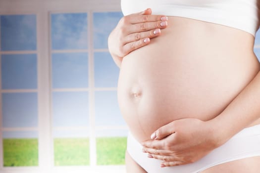 Pregnant woman loving her baby