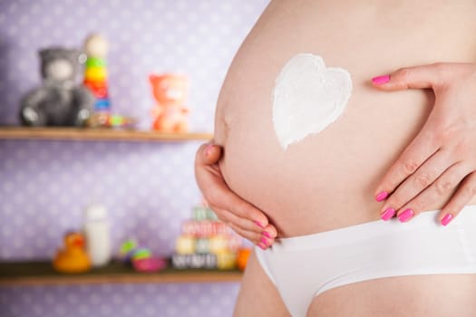 Pregnant woman loving her baby