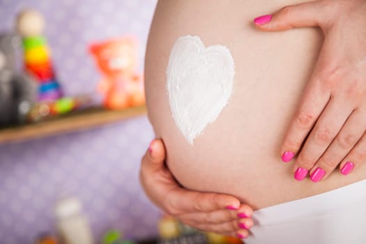 Pregnant woman loving her baby