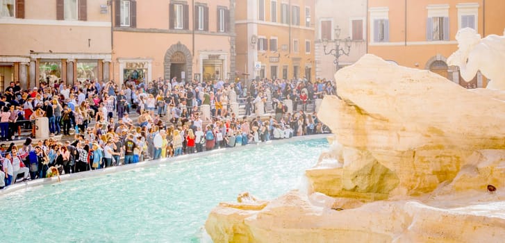 Rome, Italy, march 2017: A crowd of tourists near the famous Fountain of Trevi (Fontana di Trevi)