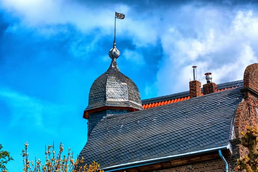 .Gable of a beautifully restored house against a blue sky