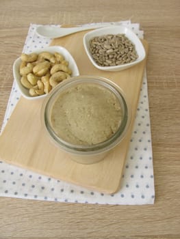 Homemade vegan nut butter from cashews and sunflower seeds in a glass