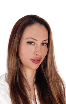 A gorgeous young woman sitting in a portrait image with her long.brunette hair, looking into the camera, isolated for white background.