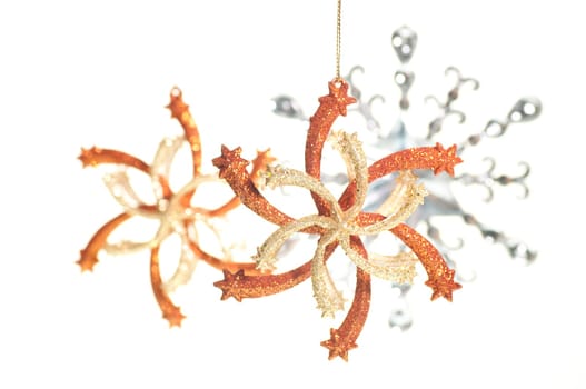Hanging gold, silver and bronze Christmas star ornaments
