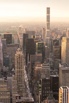 New York City skyline with Manhattan urban skyscrapers at dramatic after the storm sunset over famous 5th avenue, USA.