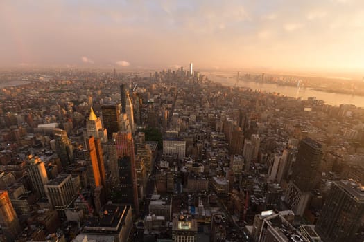 New York City skyline with Manhattan urban skyscrapers at dramatic after the storm sunset, USA.