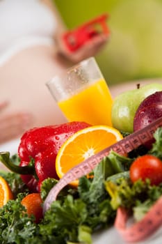 Pregnancy, healthy food and people concept