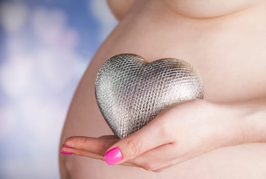 Pregnant woman loving her baby