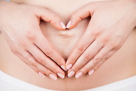 Pregnant woman holding a heart