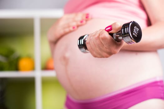 Pregnancy, sport, fitness, healthy lifestyle concept
