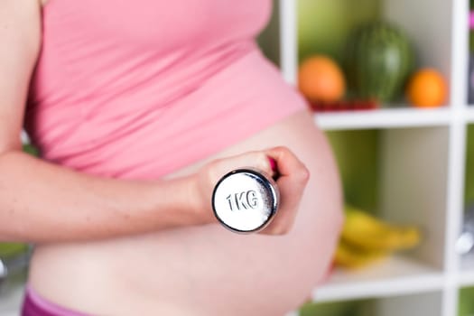 Pregnancy, sport, fitness, healthy lifestyle concept