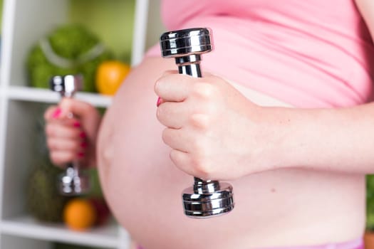 Pregnancy, sport, fitness, healthy lifestyle concept