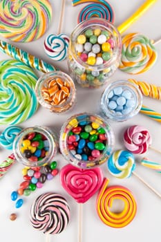 Glass jars in Colorful candies,lollipops and gum balls