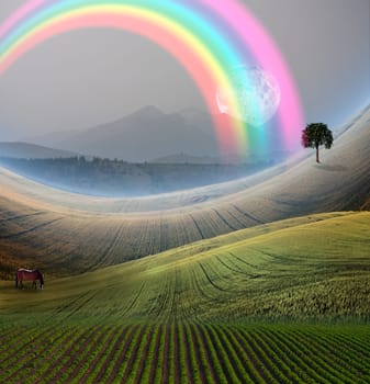 Peaceful Landscape with Mountain and rainbow. Giant moon rises at the horizon. Horse grazes in the field