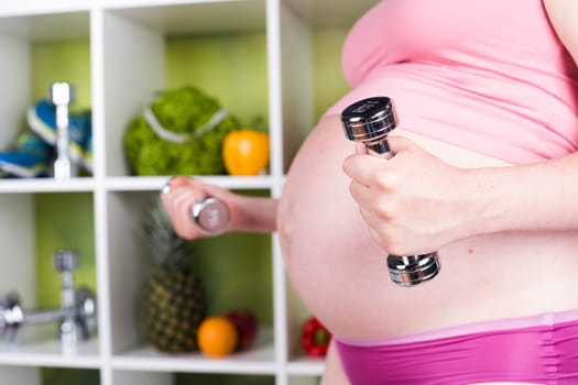 Pregnancy, sport, fitness, healthy lifestyle concept