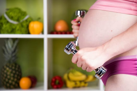 Pregnancy, sport, fitness, healthy lifestyle concept