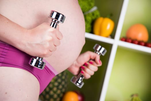 Pregnancy, sport, fitness, healthy lifestyle concept