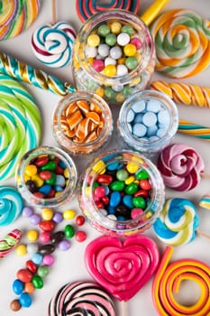Glass jars in Colorful candies,lollipops and gum balls