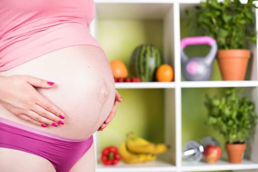 Pregnancy, healthy food and people concept