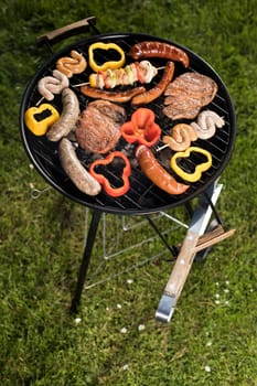 Grill with red hot briquettes, fire background