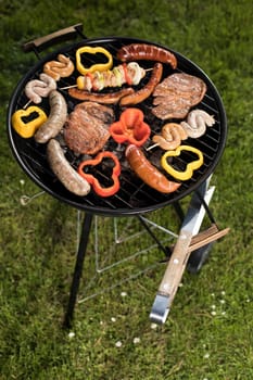 Grill with smoke over summer outdoor nature in garden