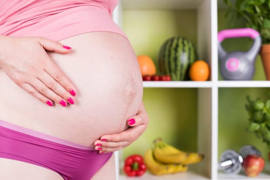 Pregnancy, healthy food and people concept