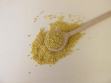 Golden millet on a wooden board