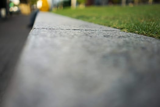 close up separated flat stone and grass.