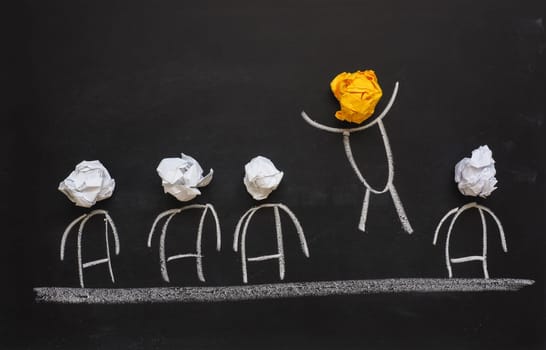 Success or great idea concept on a chalkboard with crumpled paper