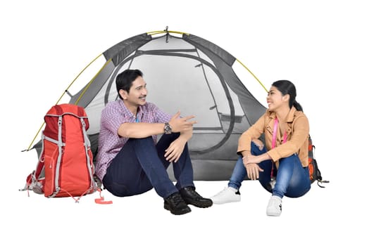 Portrait of asian couple discussion in front of tent isolated over white background